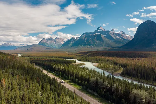 Aerial view of vehicles on scenic Icefields Parkway highway between Banff and Jasper National Parks 