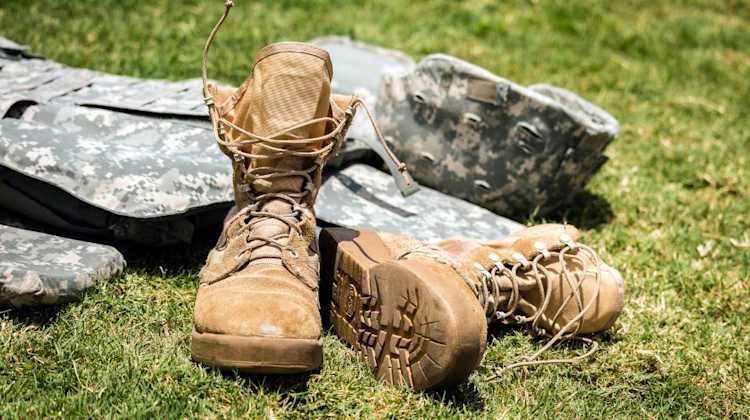 uniform boots and cover on ground after final PCS move