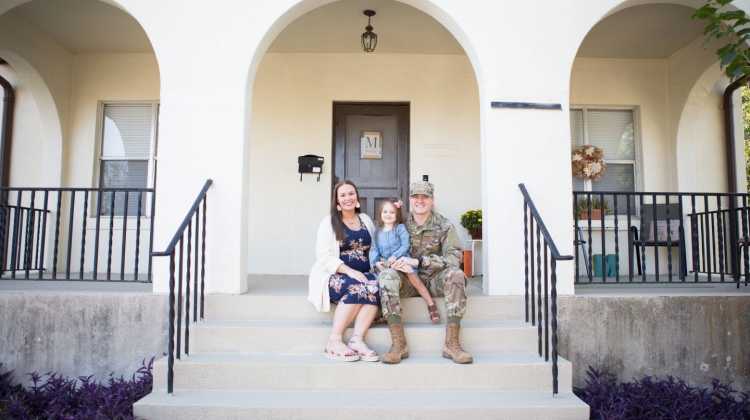 military family sitting on entry steps