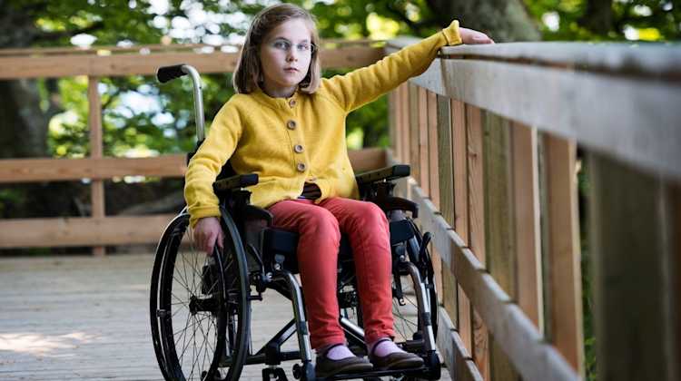 young girl in wheelchair