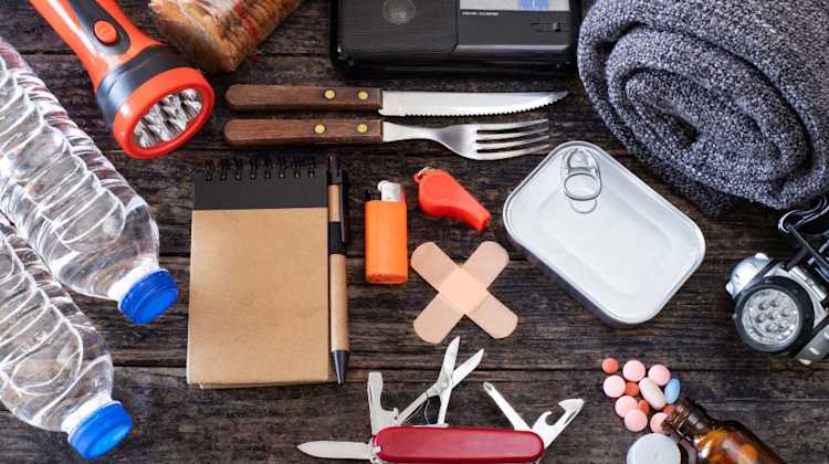 Prepare for an Emergency like a pro, with these essential supplies: first aid items, blanket, flashlight, water, food, and radio.