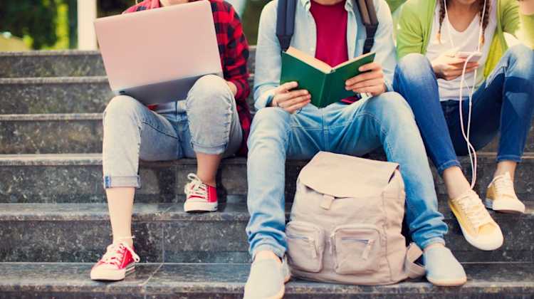 Military teens deal with the stress of PCS moves by relaxing with music, friends, books, and a laptop