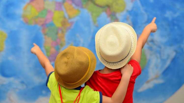 children pointing at map