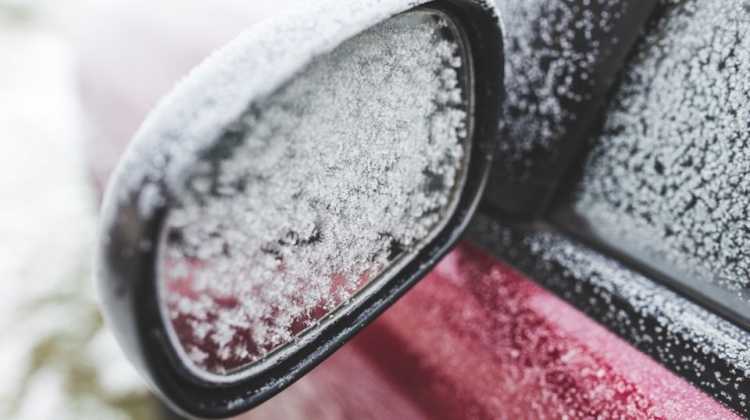 side view mirror covered in frost