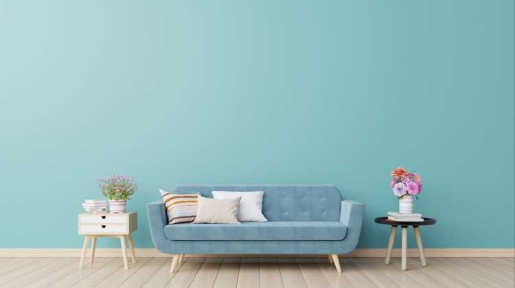 blue couch on blue wall