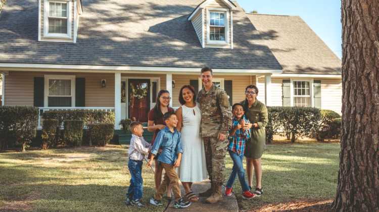 Military family choosing where to live after military retirement. Image of veteran buying a home.