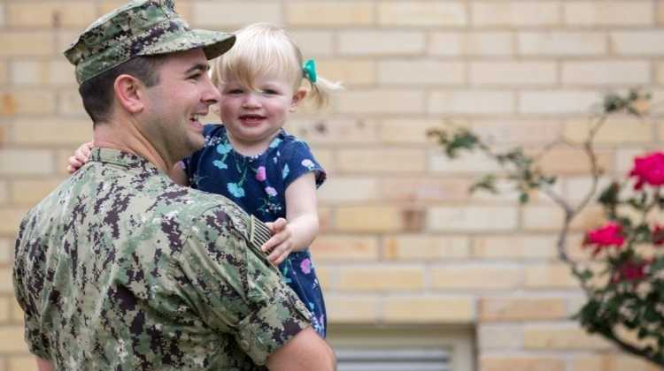 soldier holding child