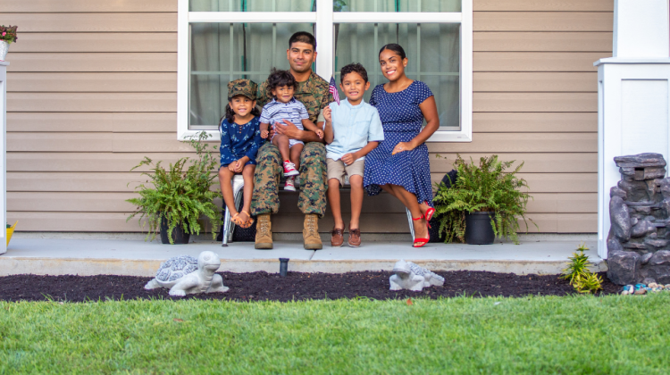 Marine family sitting on front porch