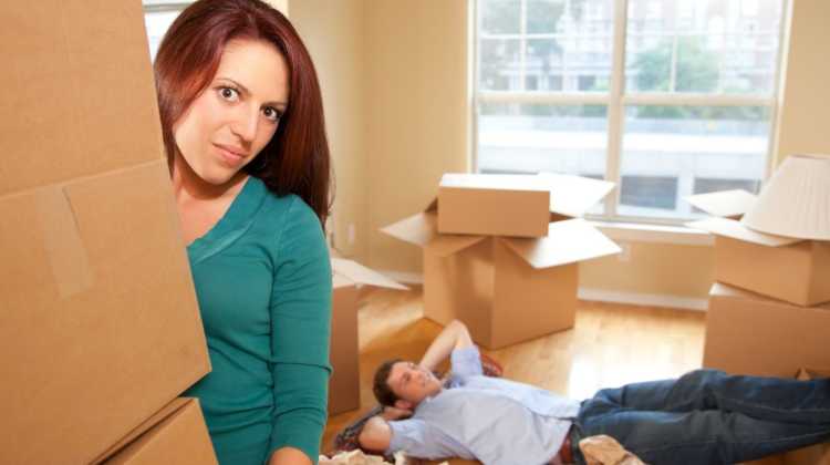 woman carrying moving box