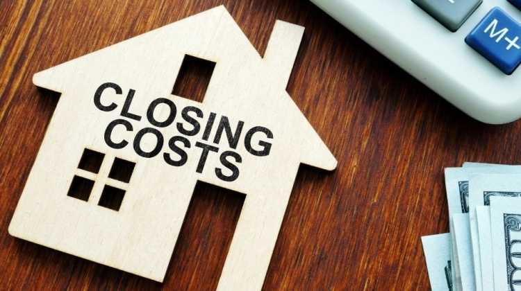 house with the words "closing costs" for military families buying or selling with VA loan