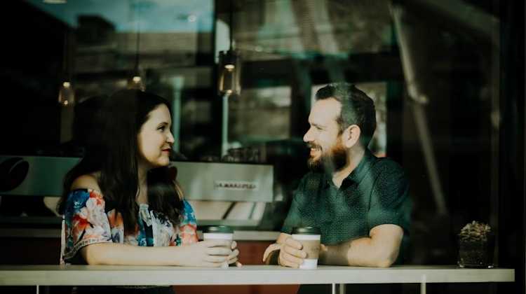 couple moving look out window