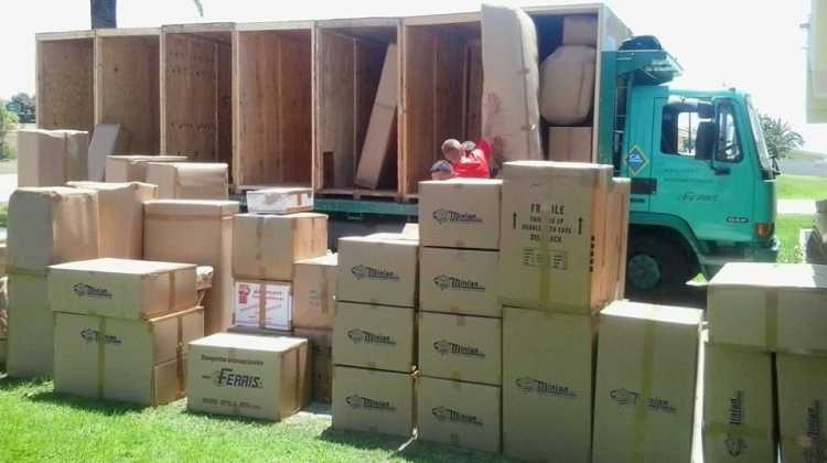 picture of moving truck with many cardboard boxes