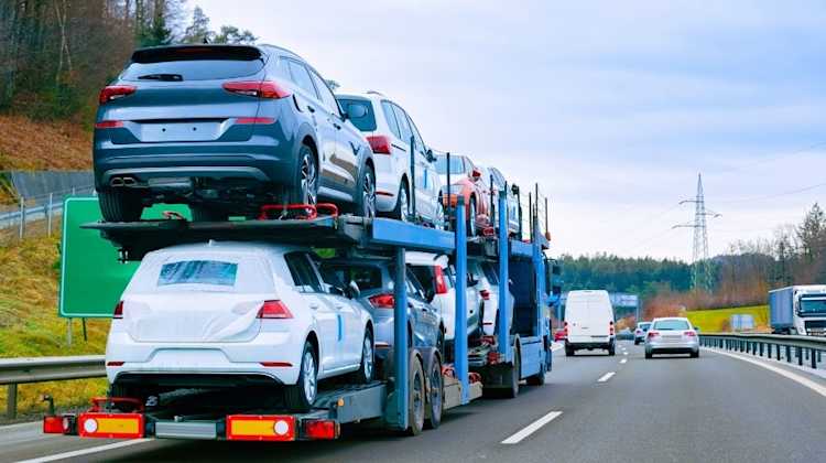 car trailer pulling multiple cars