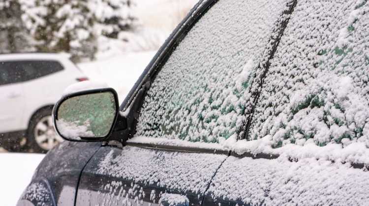 side view of frost covered car