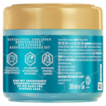 Türkisfarbener Behälter mit goldenem Deckel, der Anleitungen zur Kopfhautmassage auf Deutsch zeigt. Grafische Symbole veranschaulichen die Anwendungsschritte. Inhalt: 300 ml.