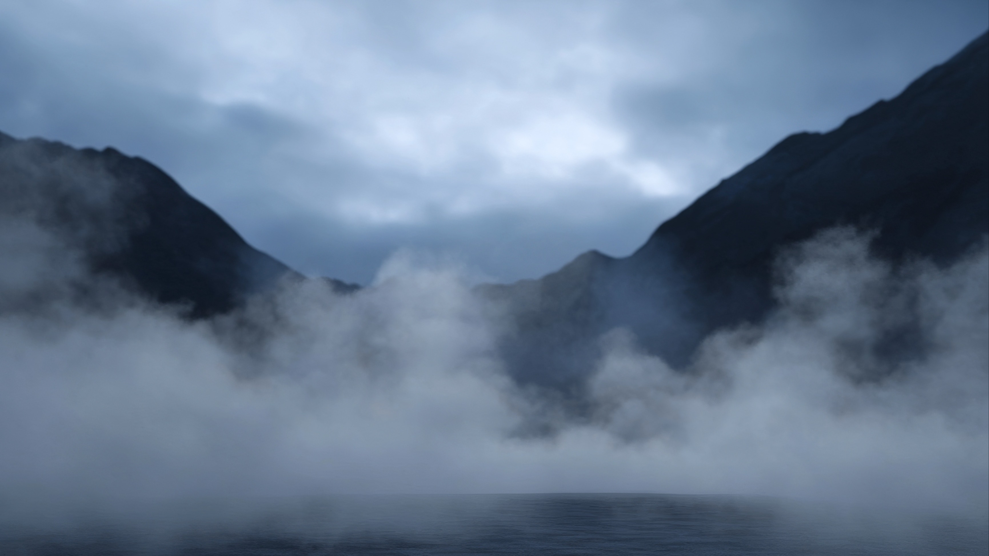 Clouds and mist around the shadows of a mountain