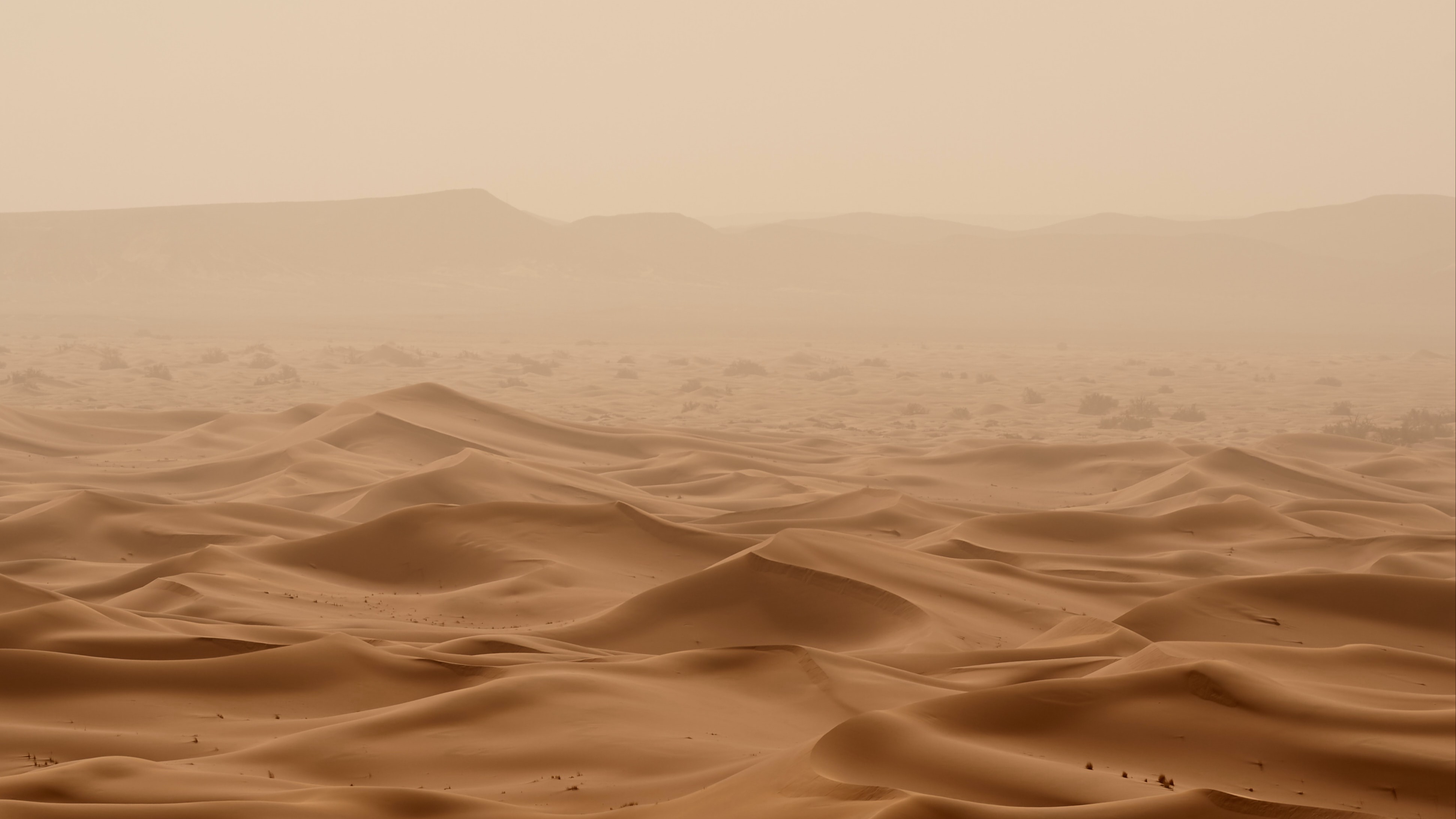 Sand and mountains in the distance