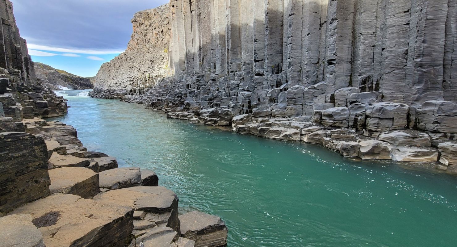 River between cliffs