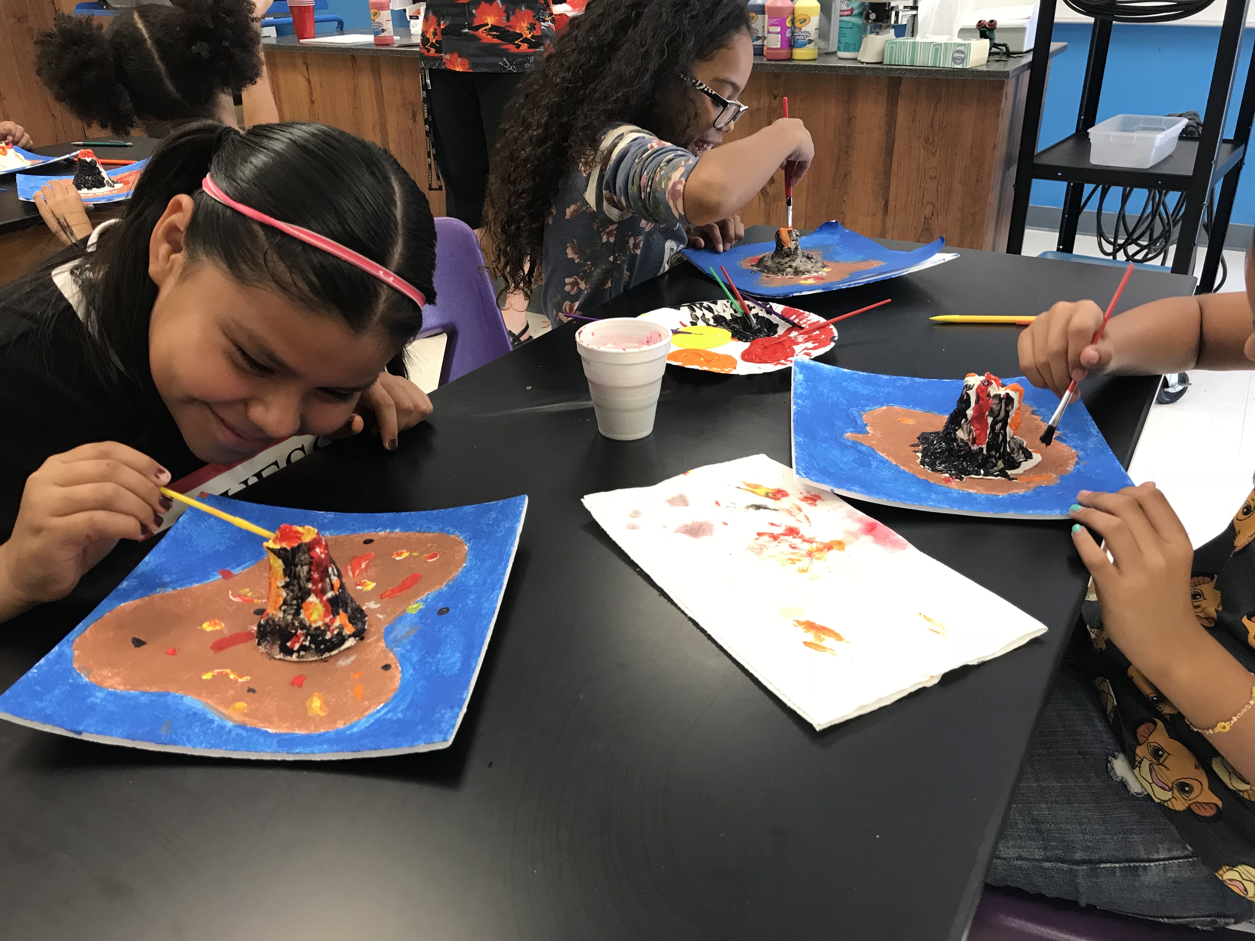 Students work on a volcano project developed from a special STEAM workshop for educators.