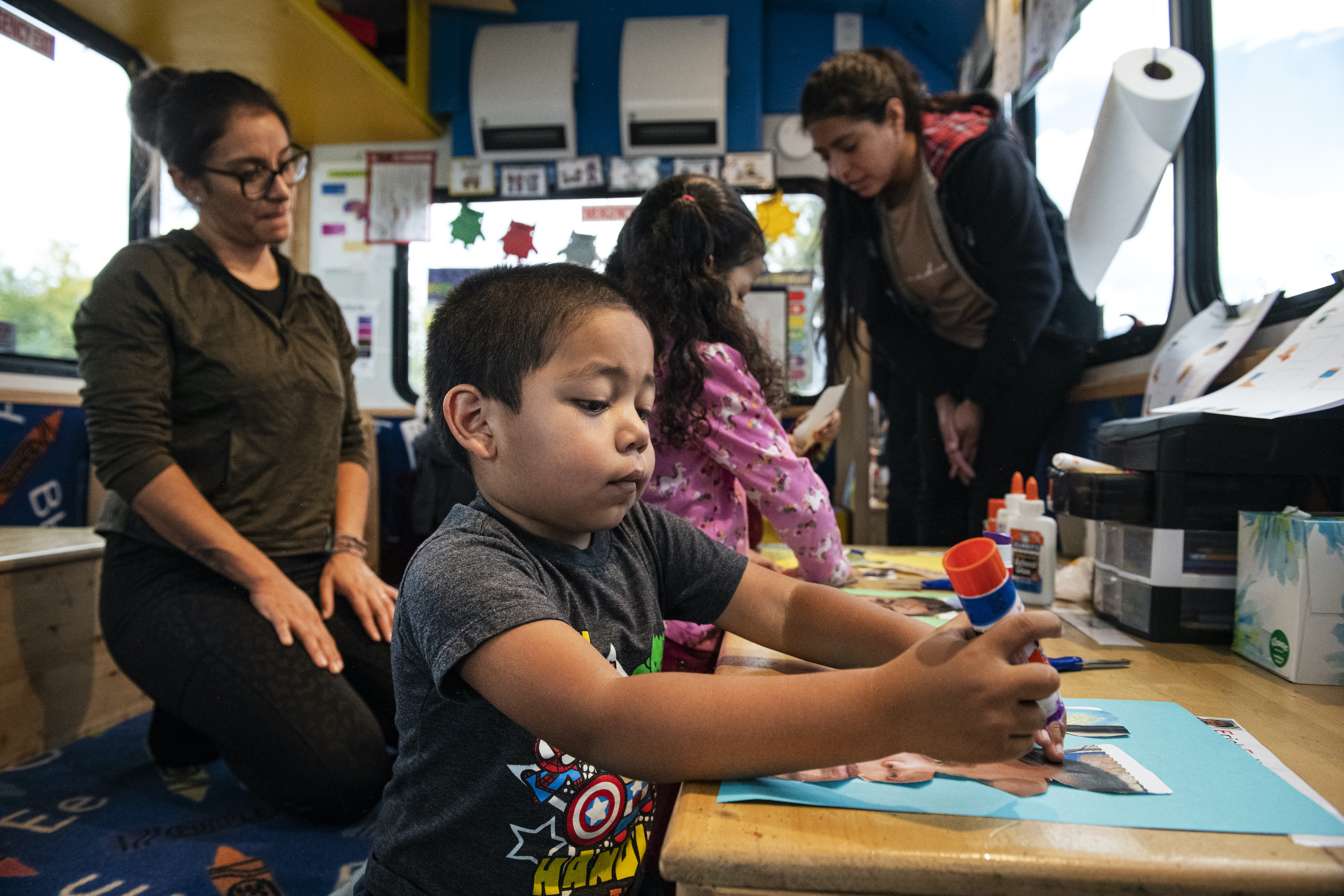 Erick Felipe Jurado, 4, glues a picture of his face back together during a learning exercise on El Busesito in El Jebel, Colorado on Thursday, September 29, 2022.