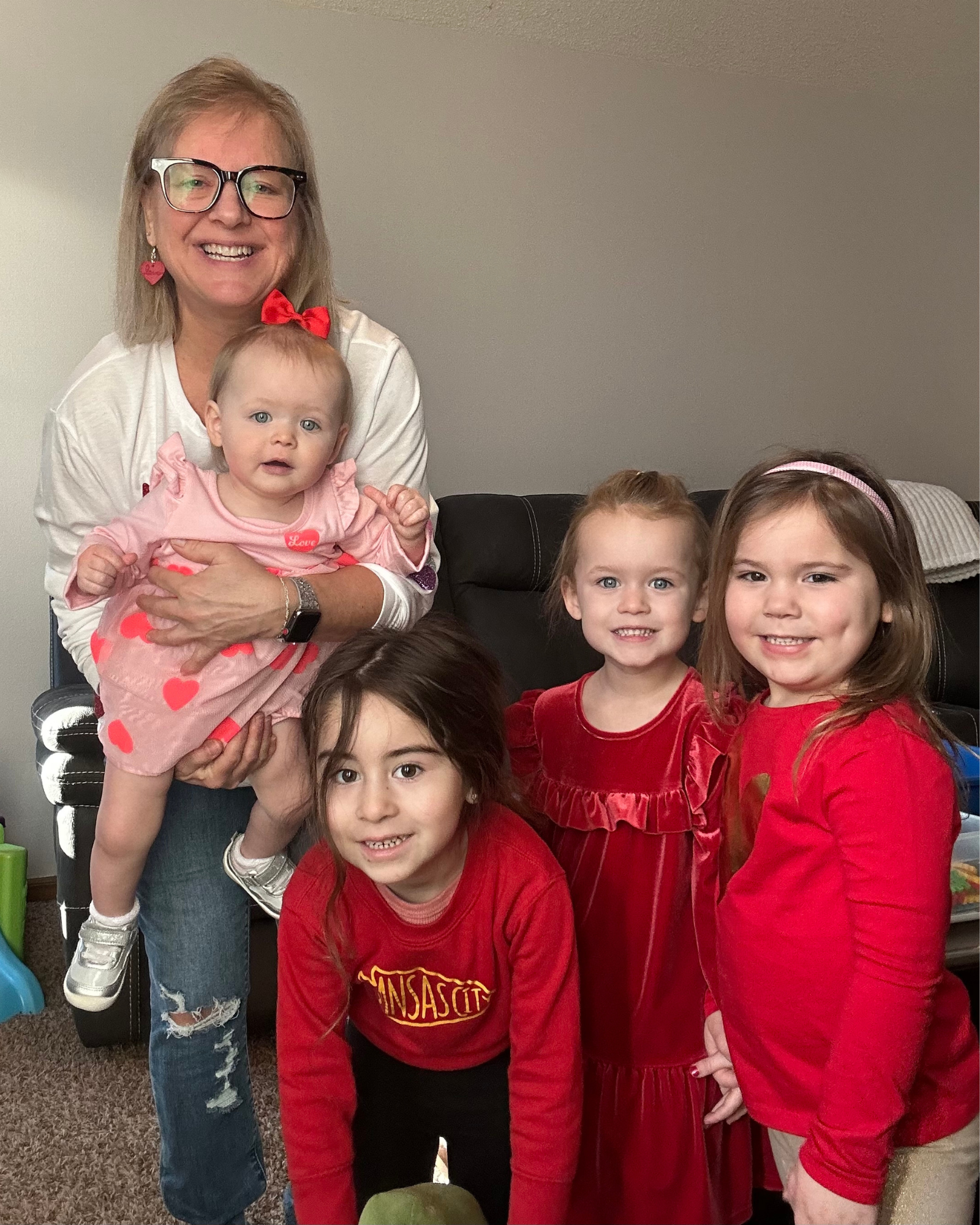 Gretchen Dunn with four children in her program on Valentine's Day 2024. Dunn learned how to screen for developmental delays during home visits from Parents as Teachers. Photo courtesy of Dunn.