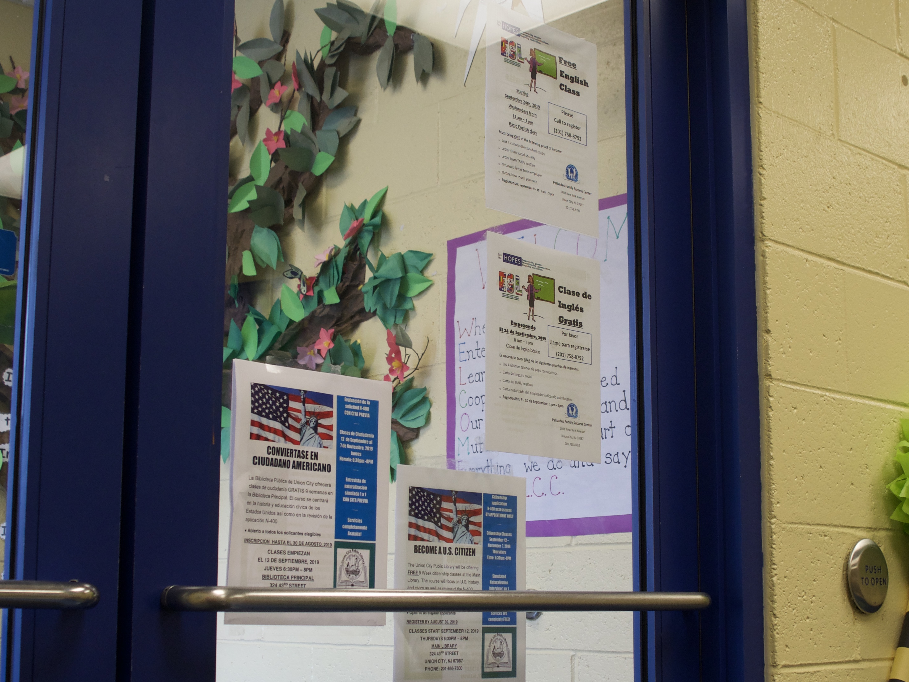 Posters for parents translated in both English and Spanish on the front doors of the Eugenio Maria de Hostas Center for Early Childhood Education. Many families of children at Union City schools speak Spanish at home. (Credit: Emily Tate)