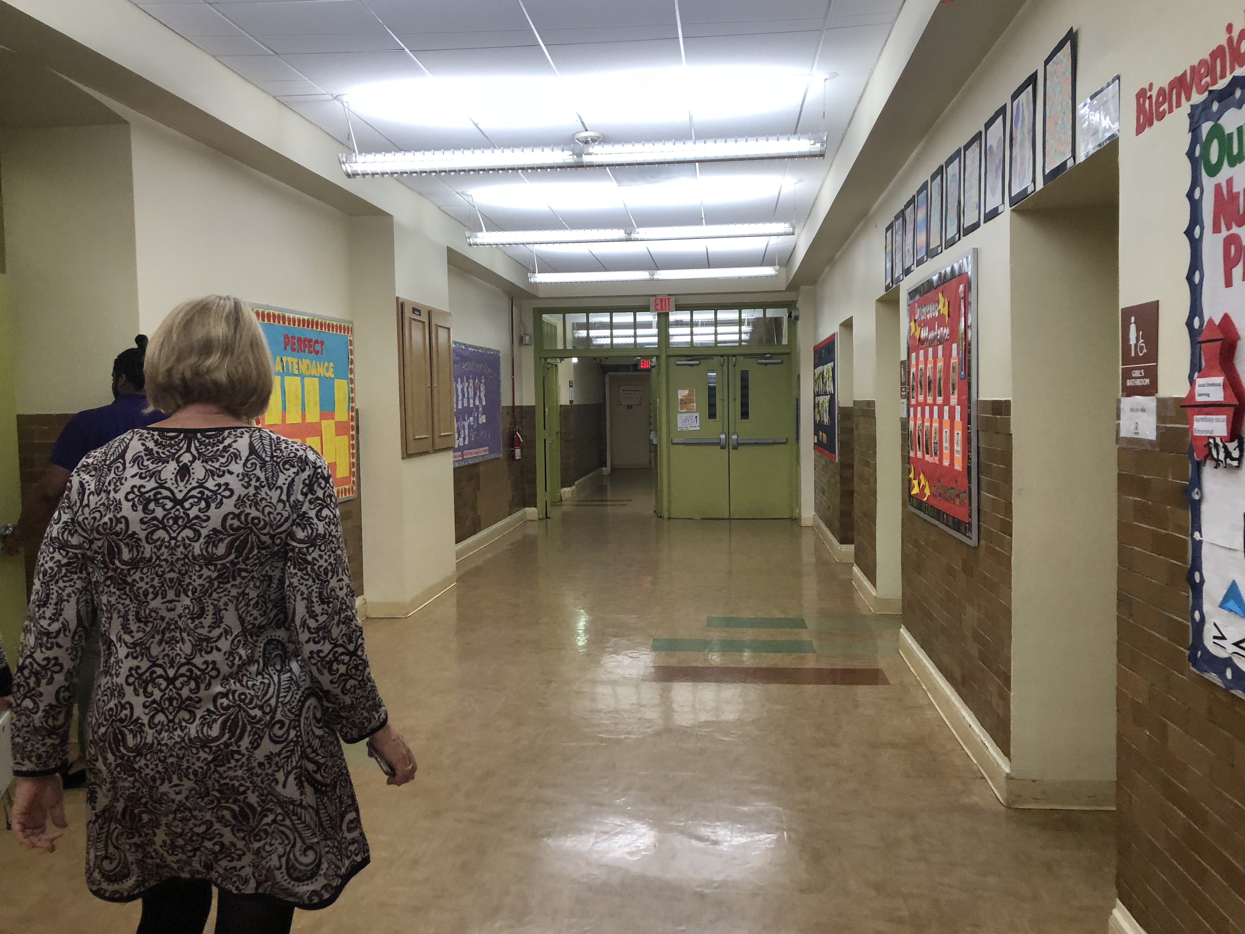 The back of principal Stinson walking through hallways at Truesdell. Photo Credit: Jenny Abamu