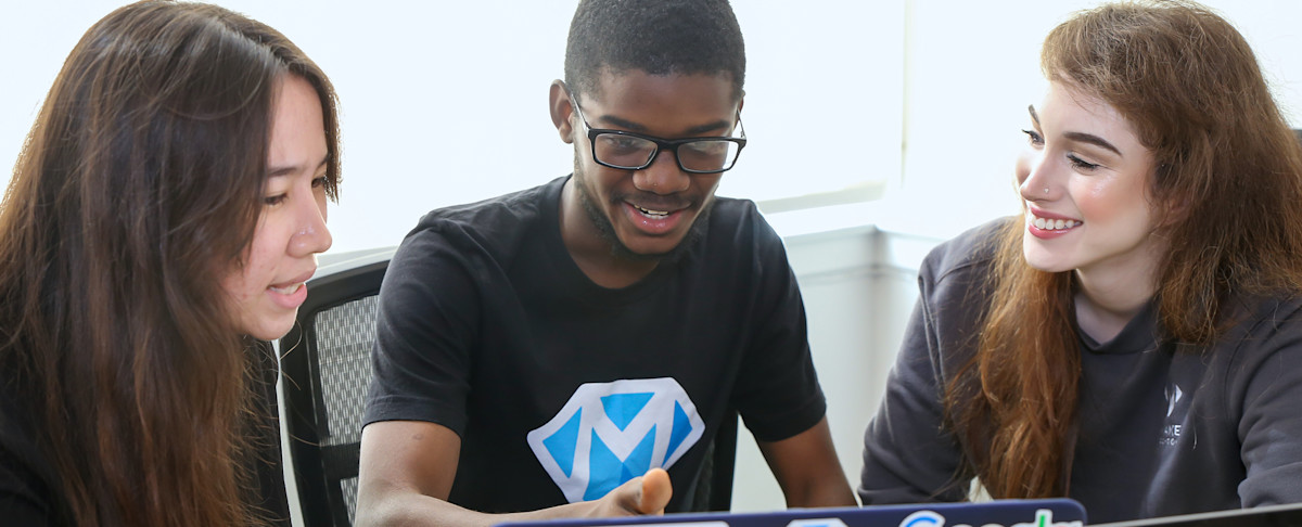 Make School students working together around a table