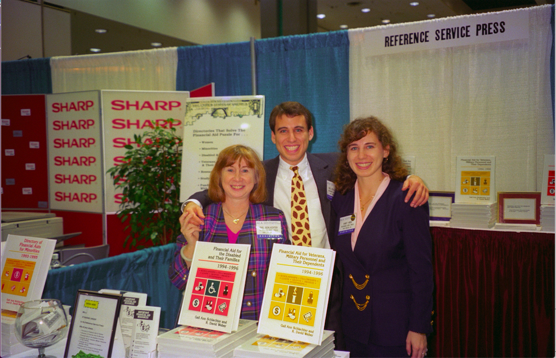 Gail Schlachter, Eric Goldman, and Sandy Hirsh, at the Reference Service Press booth at a conference.