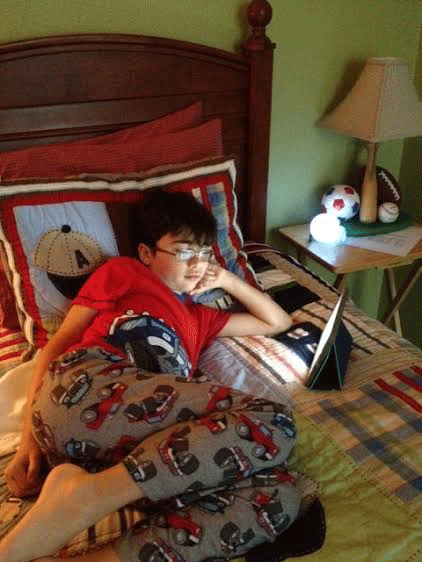 Jose Alvarez reading on an iPad.