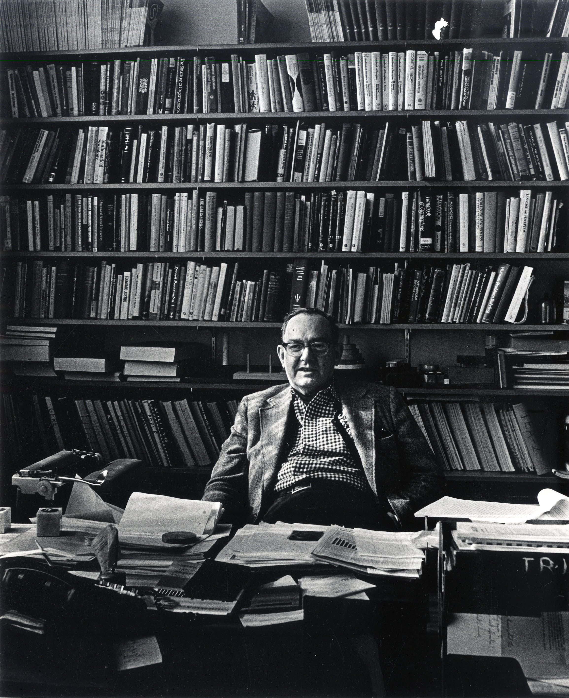 Herbert Simon, a pioneer in artificial intelligence and learning engineering who died in 2001, is immersed in his office at Carnegie Mellon University. (Photo by Clyde Hare, courtesy of Carnegie Mellon University)