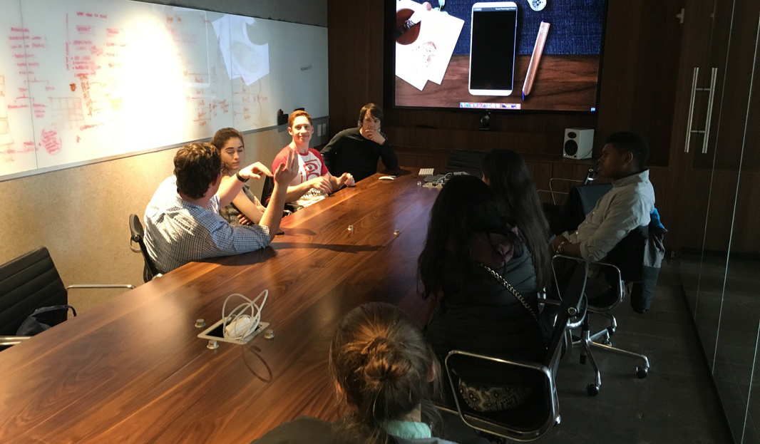 Students learning about product ideation with the founder of FiftyThree