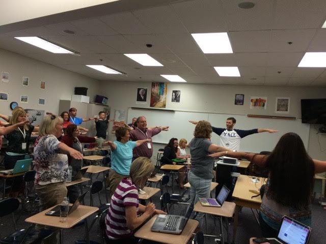 Wyoming educators get up and stretch in the middle of a PD Day. (Lachelle Brant)