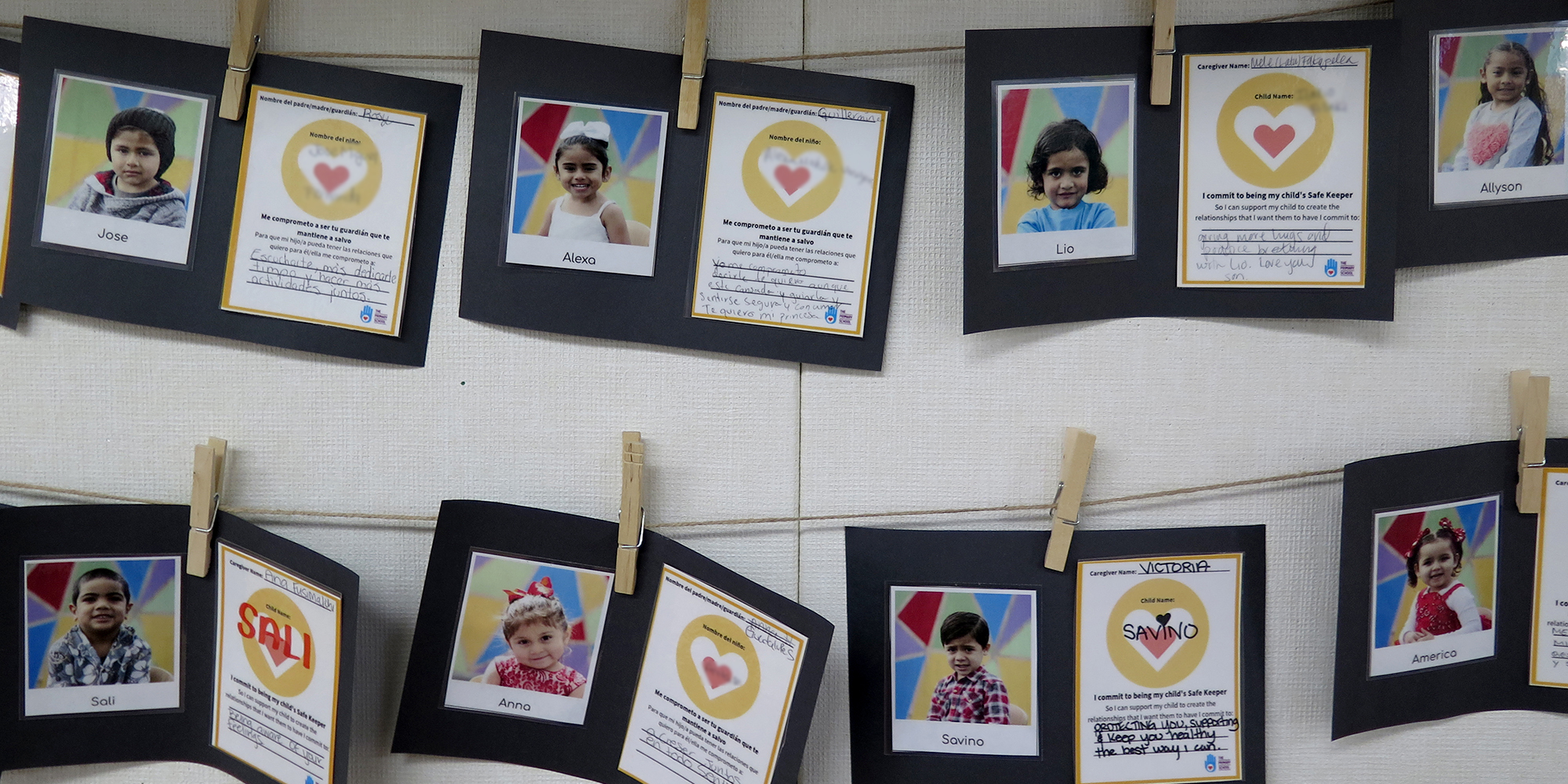 Parents’ handwritten commitments to their children are posted on classroom walls. (Photo credit: Tony Wan)