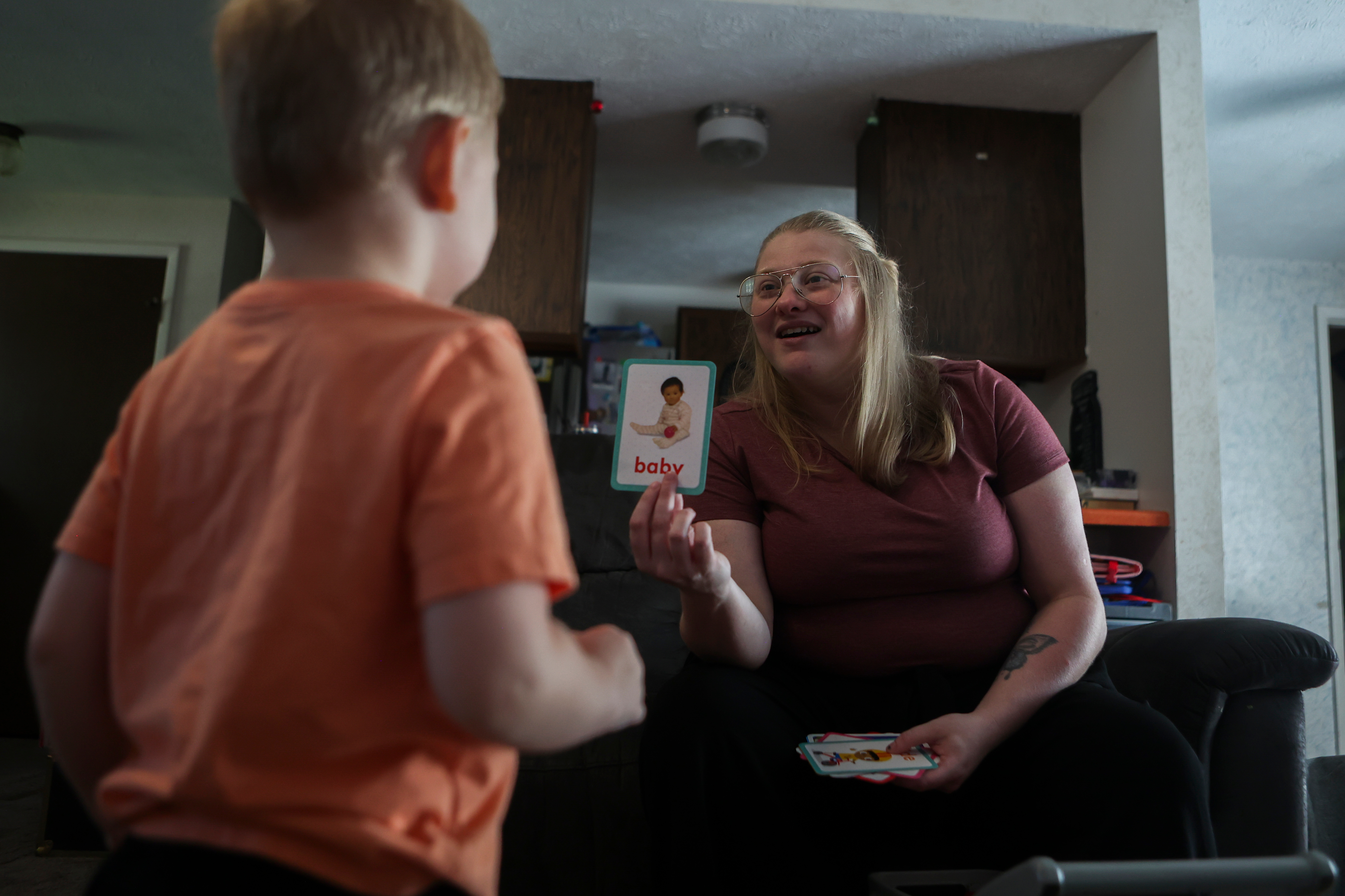 Meygan Maloney goes through flashcards with her son Callum, Friday, Aug. 28, 2026, at their home in Hartford City, Ind.