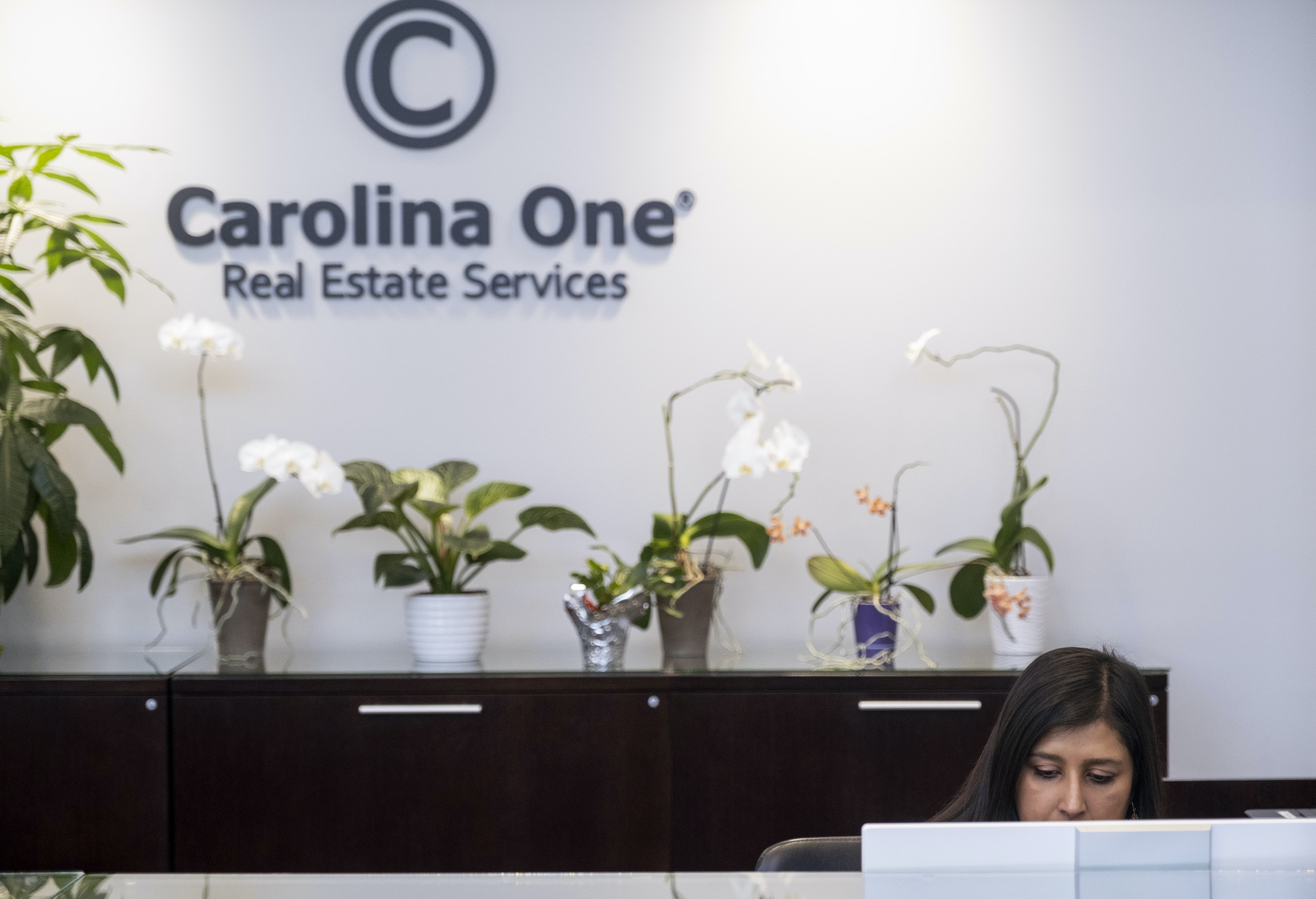 Swati Linder working a shift at the office of Caroline One Real Estate, where she is a realtor. Photo by Gavin McIntyre for EdSurge