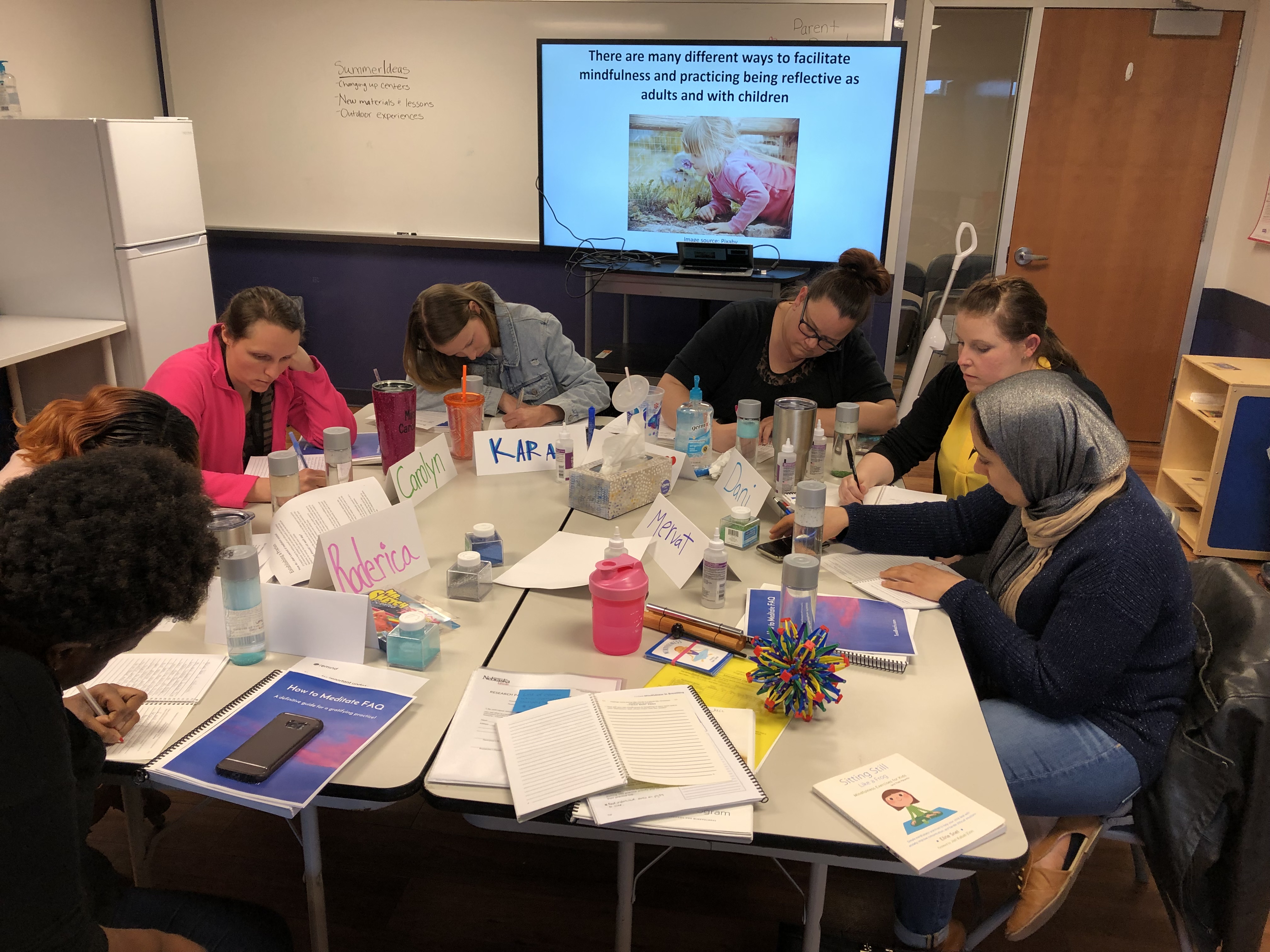 Early childhood educators in Lincoln, Neb., journal as part of a lesson on mindfulness during the CHIME program. (Courtesy of Holly Hatton-Bowers)