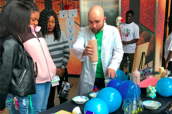 Science demonstration by GSU volunteer student. Photo Credit: Martha Karmali