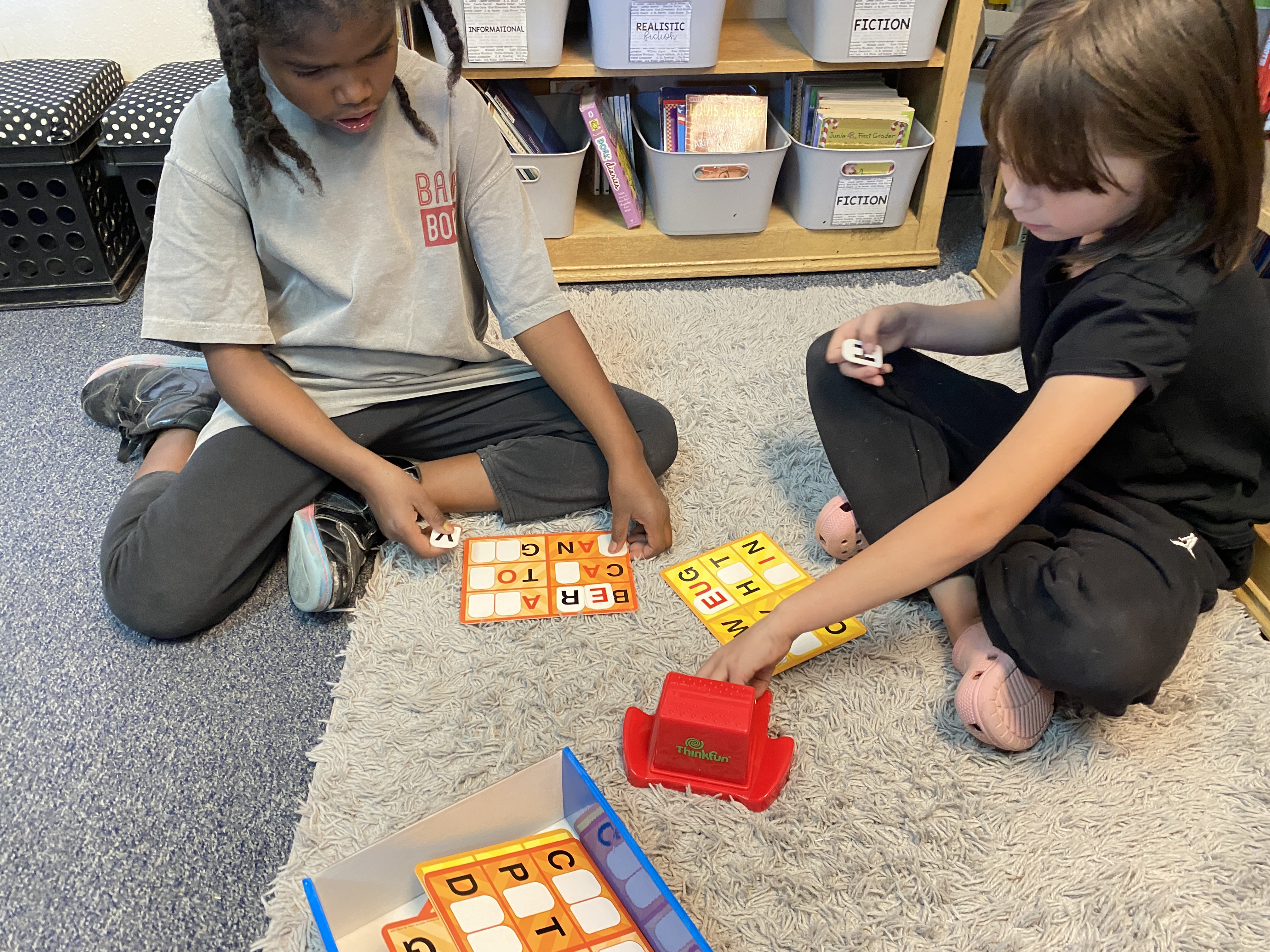 Elementary students play games that help with quantitative, verbal or non verbal skills.