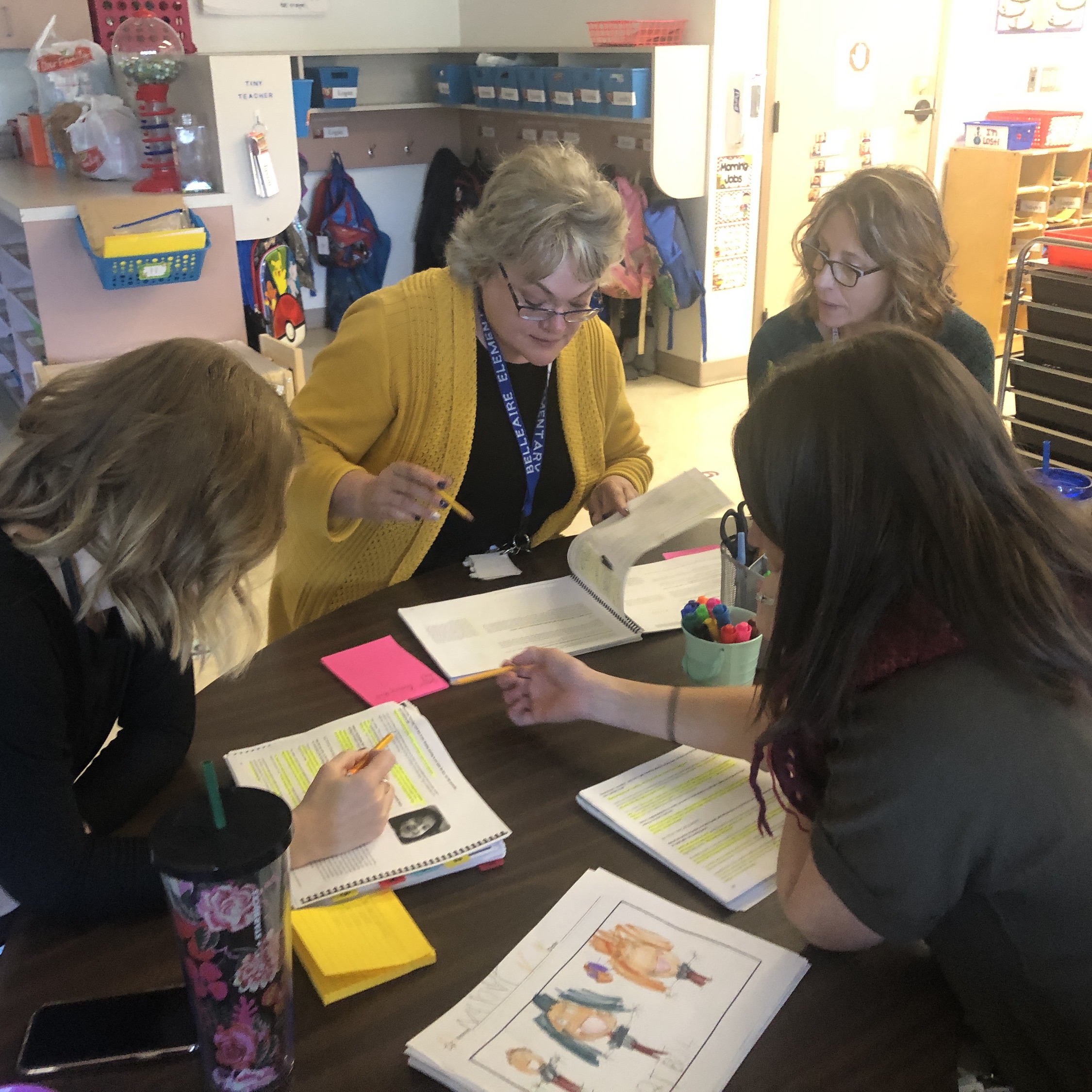 Kindergarten teachers Pam Helmick and Kelsea Heesacker met with educational facilitator Mary Beth Pistillo and instructional coach Rachael Eversole to plan out writing lessons for the kindergarteners. Credit: Sharon Lurye.