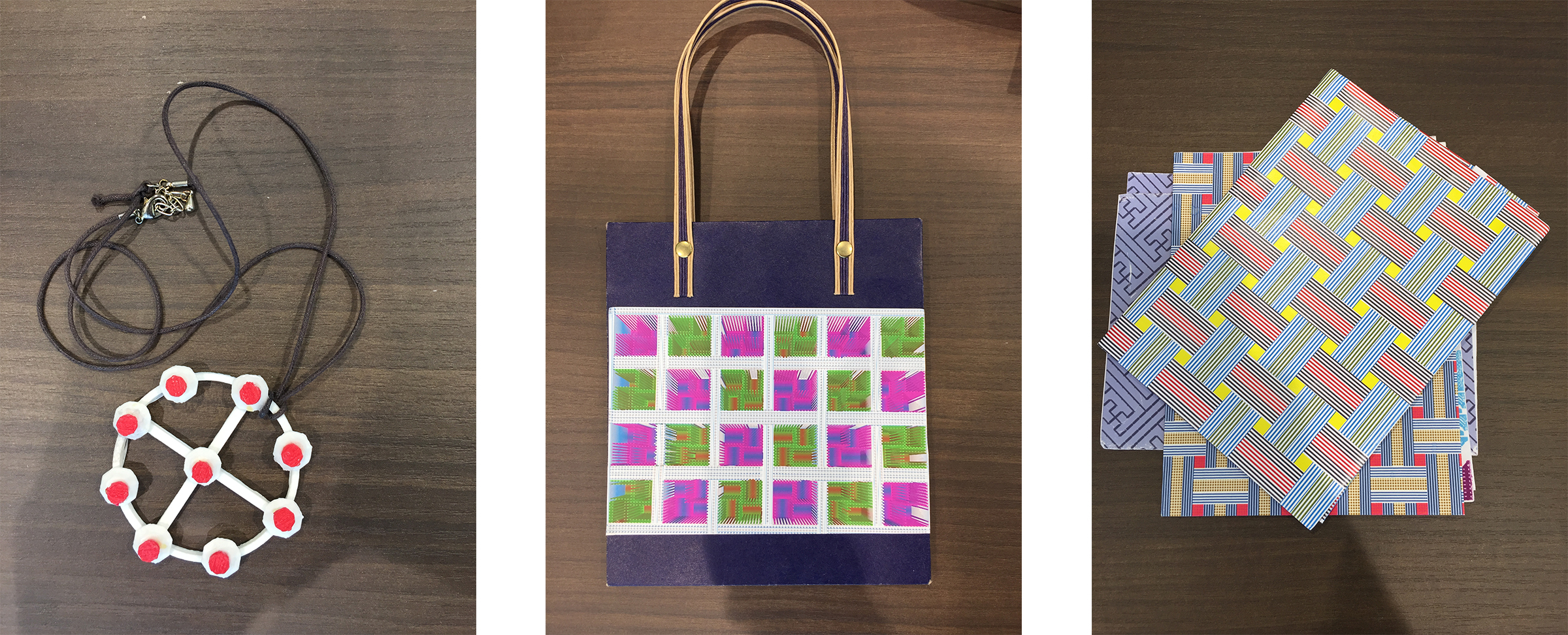 Wakamiya's designs, from left to right: A 3-D printed pendant, a Shinto-inspired 3-D pattern pasted onto a gift bag, and repeating patterns on paper. (Photo Credit: Sydney Johnson)