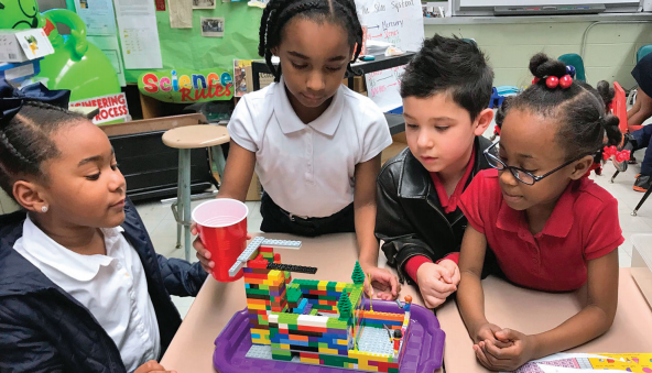 Early Learning Center students in St. Martinville, LA work on their FIRST LEGO League Jr. model.