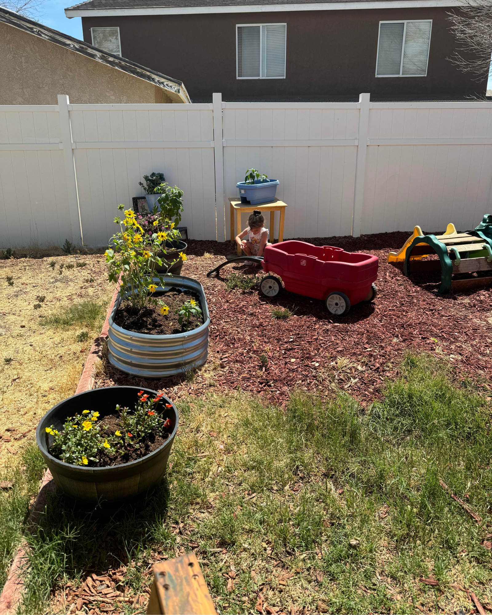 Without a shade structure or heat-resistant playground equipment, much of Tessie Ragan's backyard is unsafe for children in her program during the hottest weeks of the summer. Photo courtesy of Ragan.