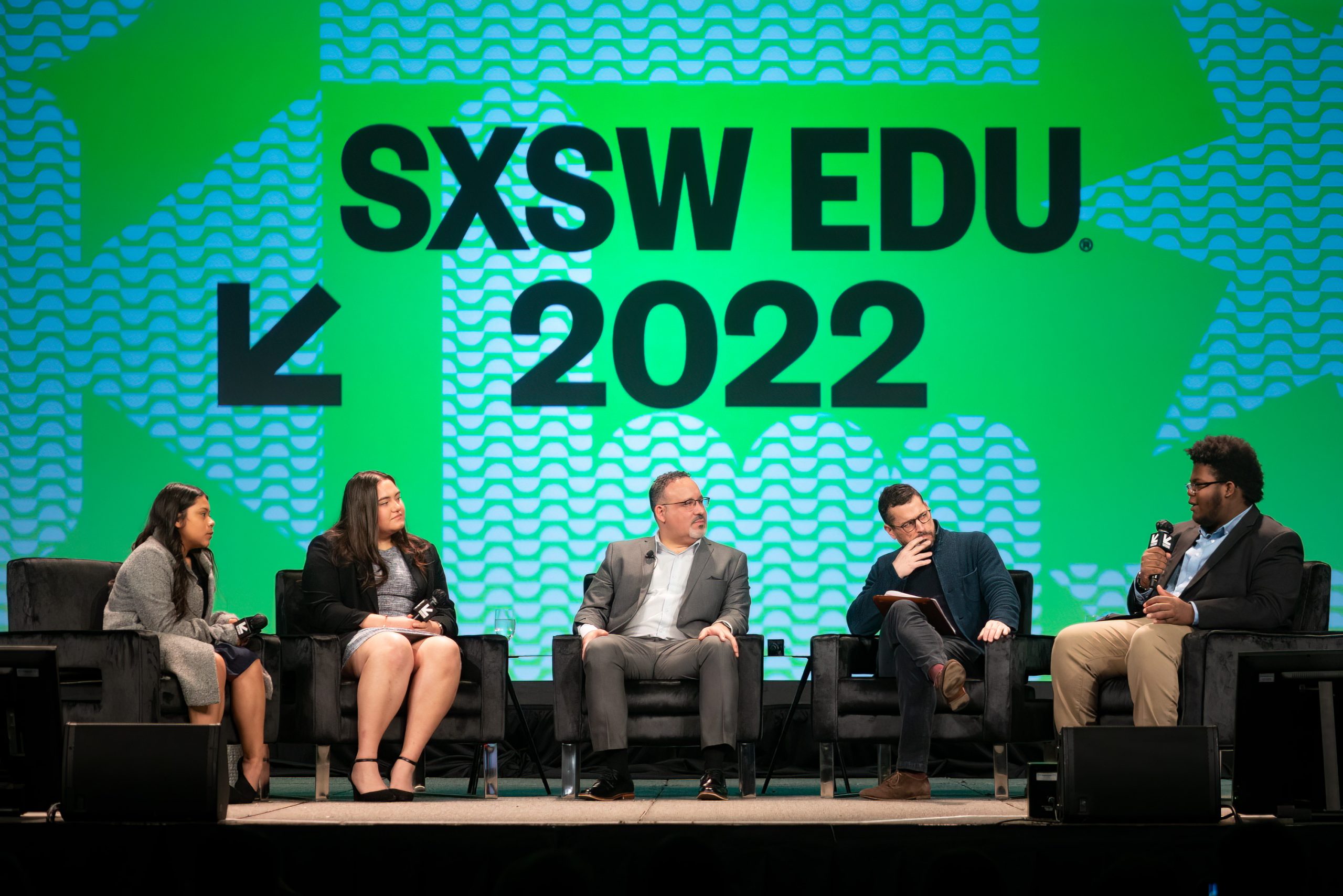 Secretary Cardona and three Austin-area students during a conversation about reimagining education at SXSW EDU on March 9, 2022. (Photo by Steve Rogers)