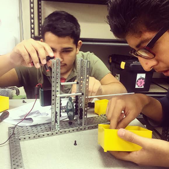 Two 10th students collaborate on a physics project in Kat Ramos's class.