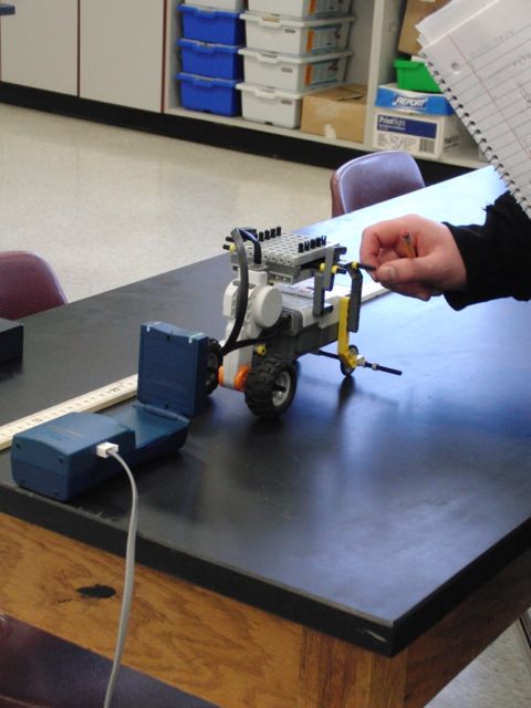 Figure 1: Student designed MINDSTORMS robot used in a physics lesson to study the effect of mass on the motion of an object. The robot system makes it very easy to control variables in a scientific investigation.