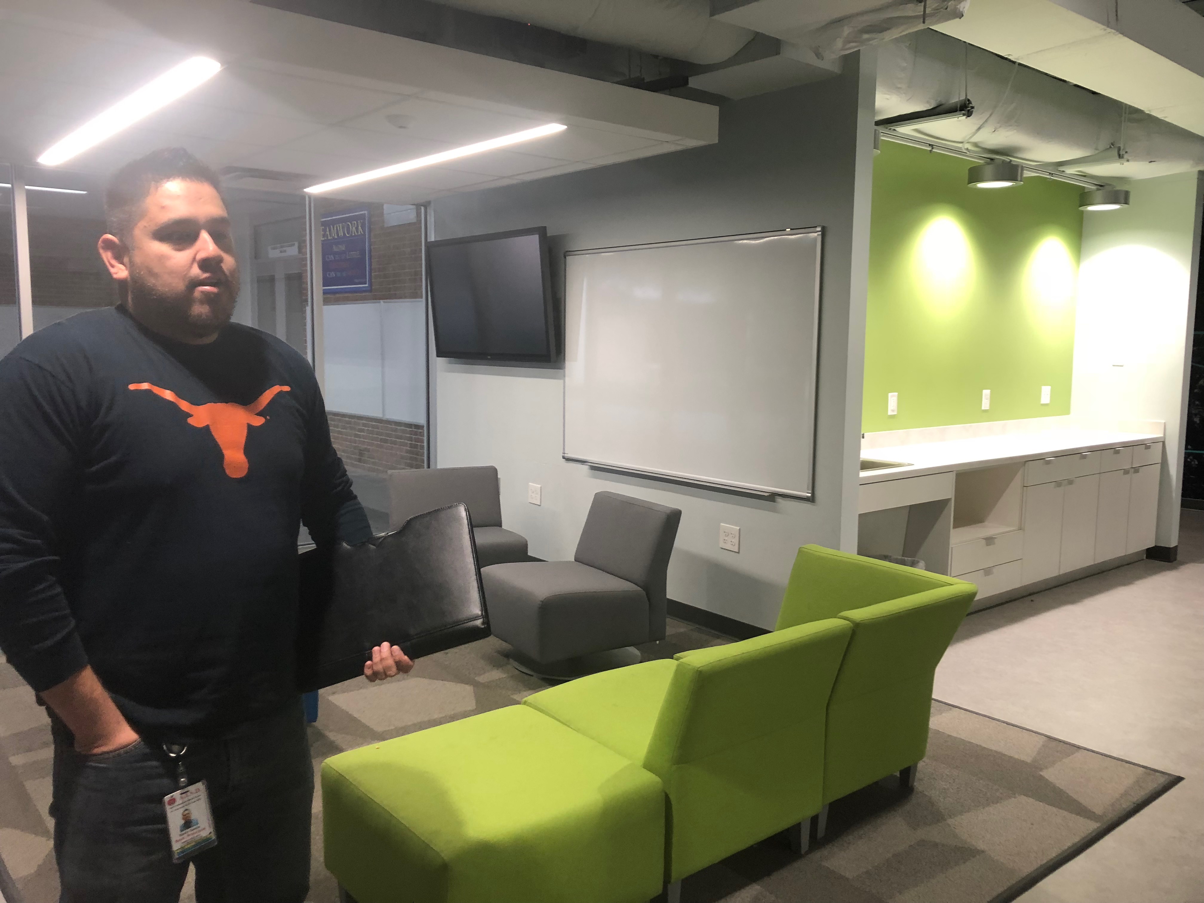 The assistant principal, Kevin Garcia, standing in the new Career Launch Center. Photo credit: Jenny Abamu