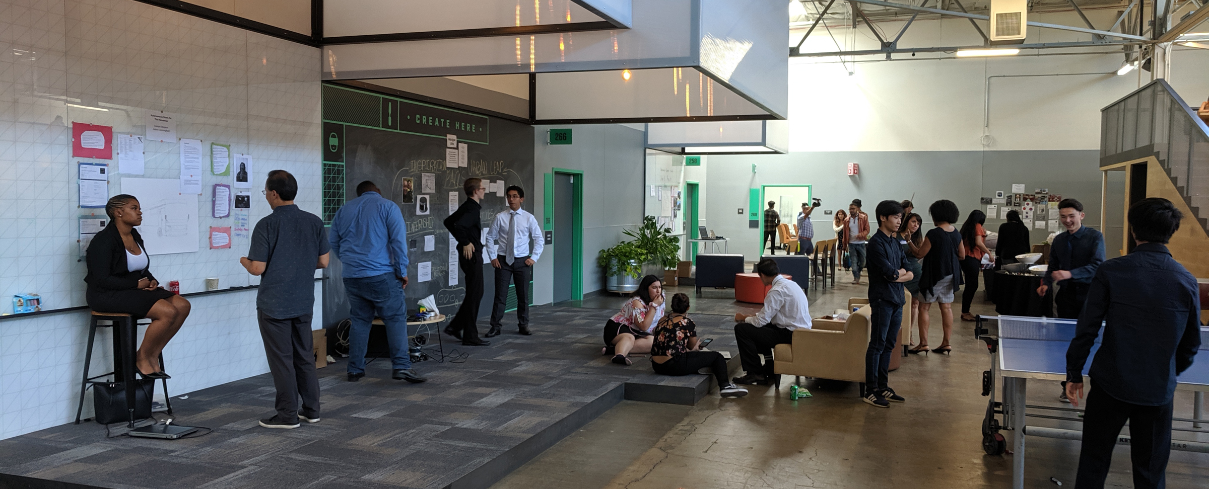 Students prepare to show off their projects at PilotCity’s Pin-Up Day. (Photo Credit: Tony Wan)