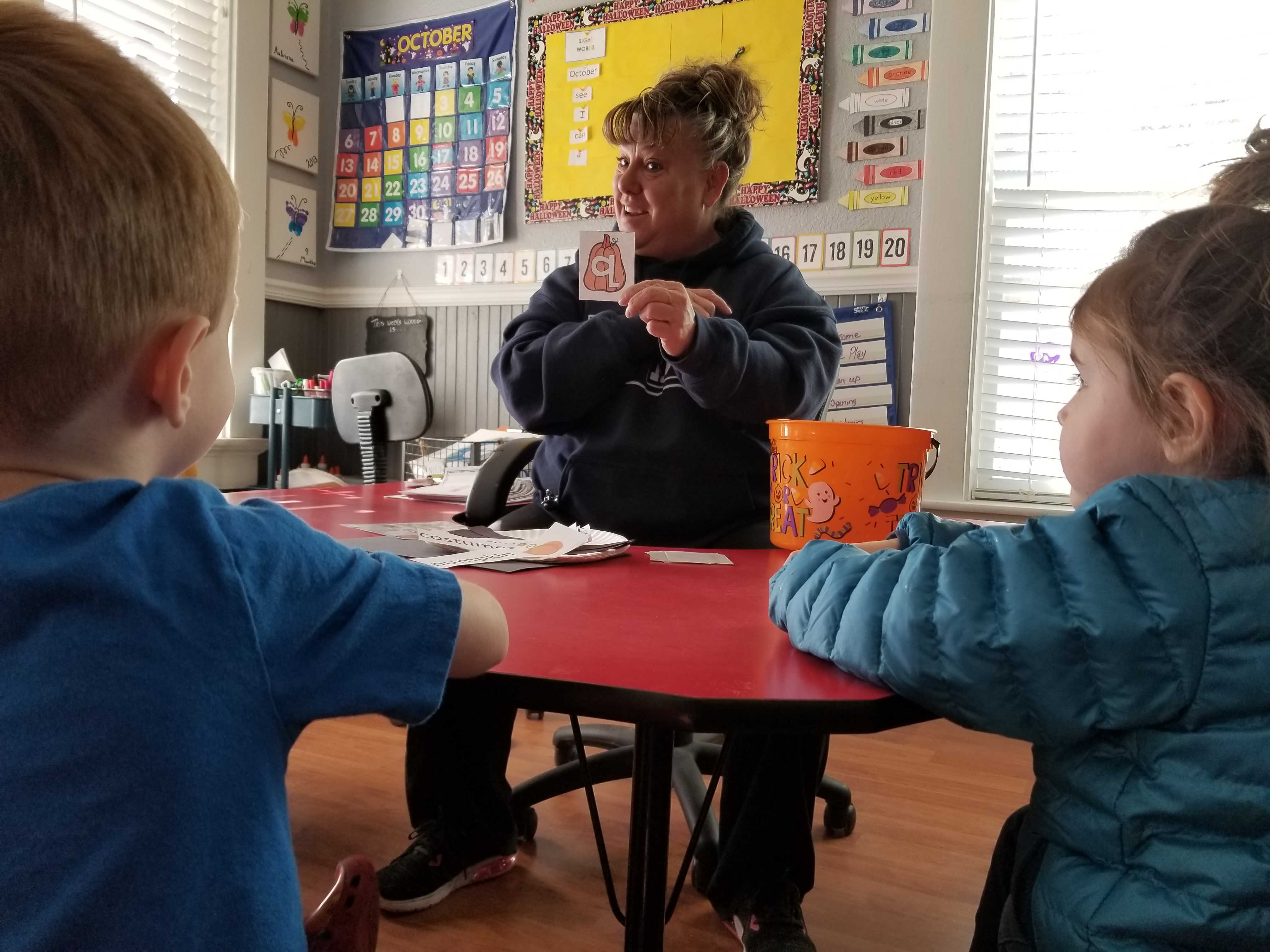 JoElla Whitesides teaches children the alphabet in her home-based preschool in Nevada. Credit: Wade Tyler Millward / EdSurge