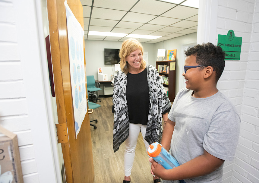 Evans and Mason share a laugh outside of her office.